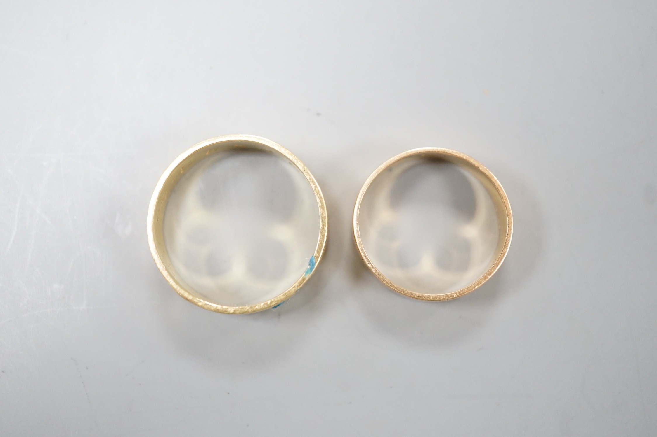 An engraved 18ct gold wedding band, size Q, 5.2 and a yellow metal band, 3.2 grams.